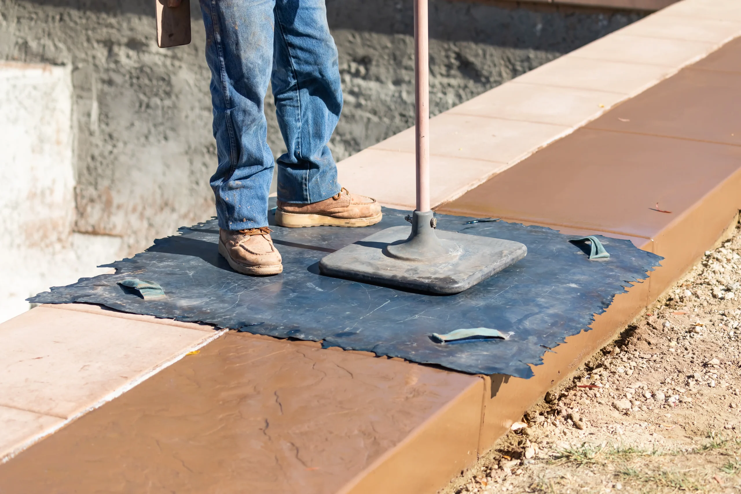 A construction worker stamping concrete